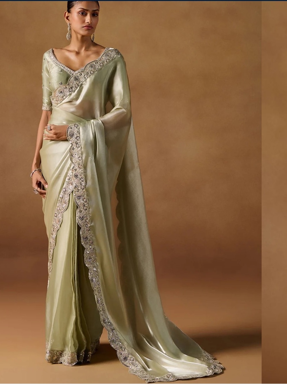 Light olive green pre-draped saree with scalloped trim
